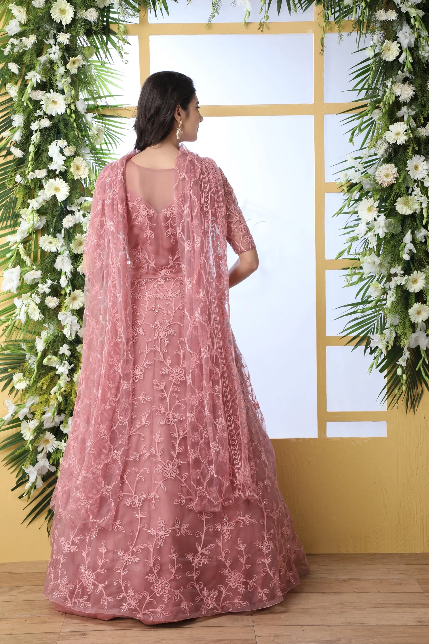 Unique Dusty Peach Colored Party Wear Embroidered Net Gown With Dupatta